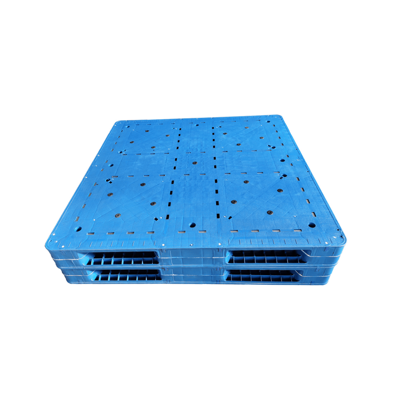 Two solid blue stackable plastic pallets stacked together